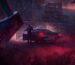 Cultic key art of man getting out of car with axe ominously positioned in foreground