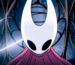 A screencap of Hollow Knight: Silksong's opening cutscene. A close-up shot of protagonist Hornet moments before she breaks out of a metal cage. Her curved white mask and red cloak are lit up as a glowing strand of silk surrounds her.